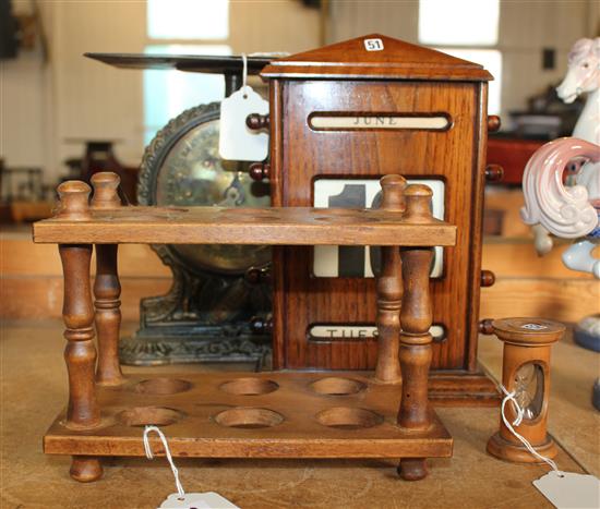 Treen desk calendar, 19C egg timer, treen egg rack and a set of kitchen scales